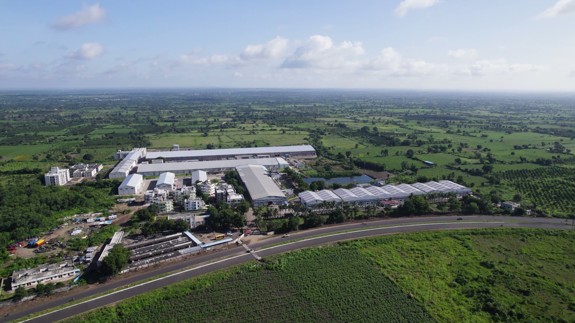 Aerial view of the Sri Bhagirath Textiles spinning mill surrounded by cotton fields near Nagpur